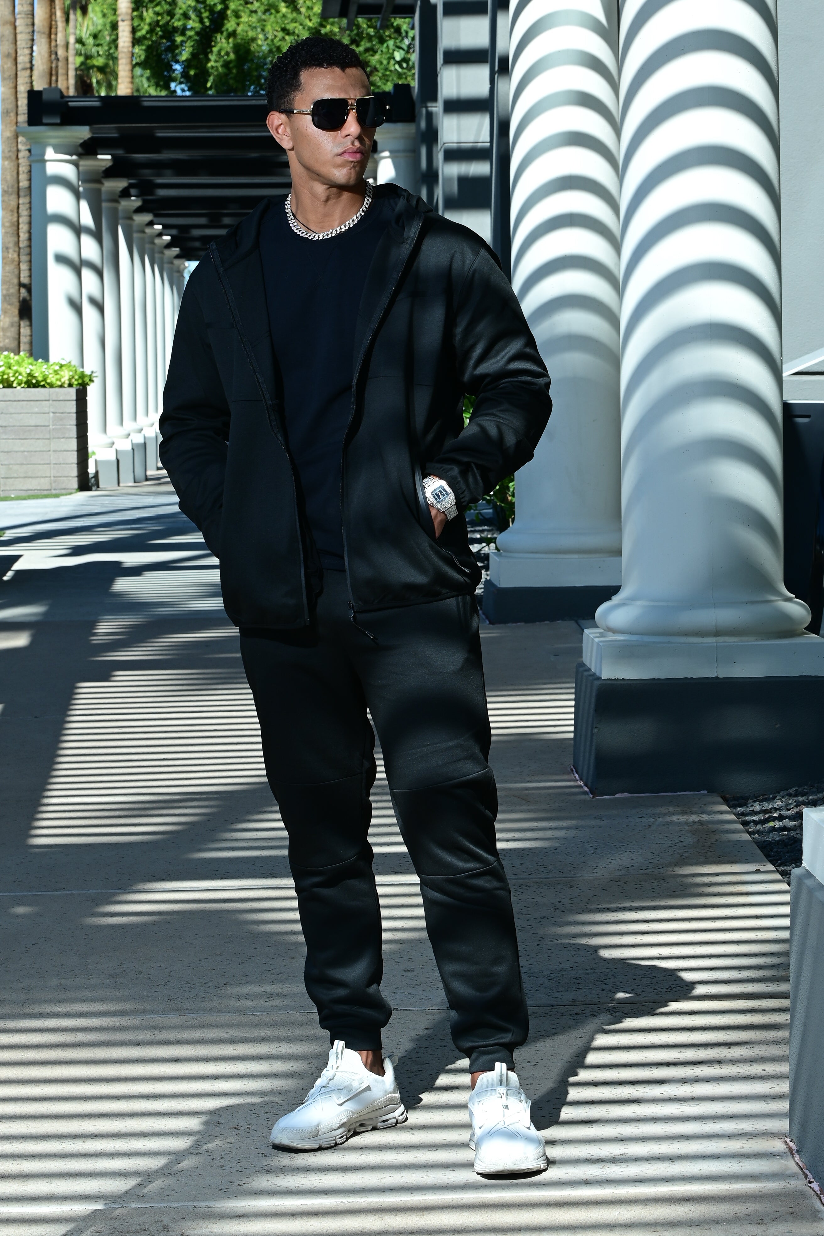 Men’s black Midnight Motion sweatsuit with zip hoodie and tapered joggers, full body front view