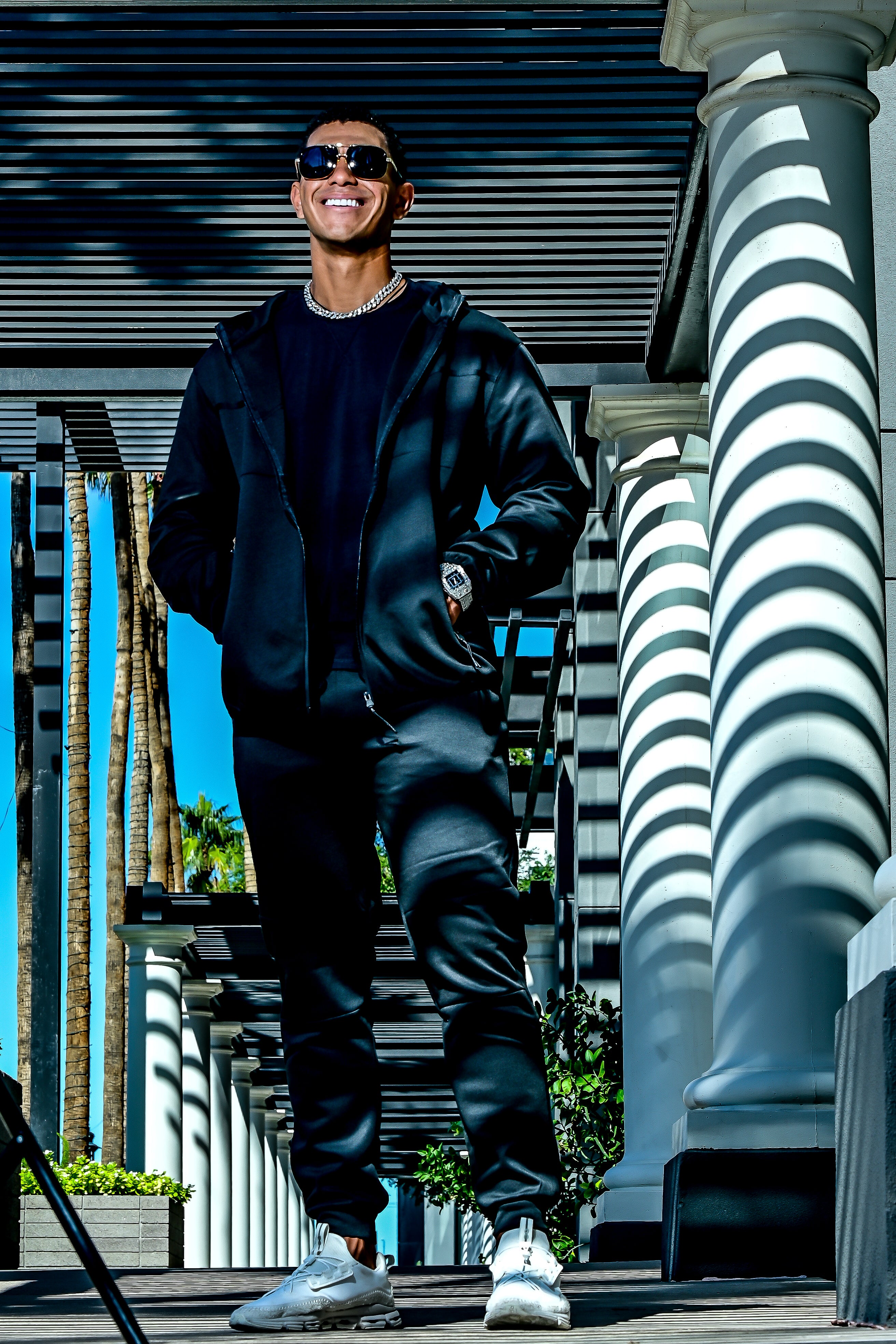 Men’s black Midnight Motion sweatsuit in motion, zip hoodie and jogger set with modern athletic fit