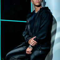 Men’s black Midnight Motion sweatsuit, zip-up hoodie and slim fit joggers, lifestyle detail view