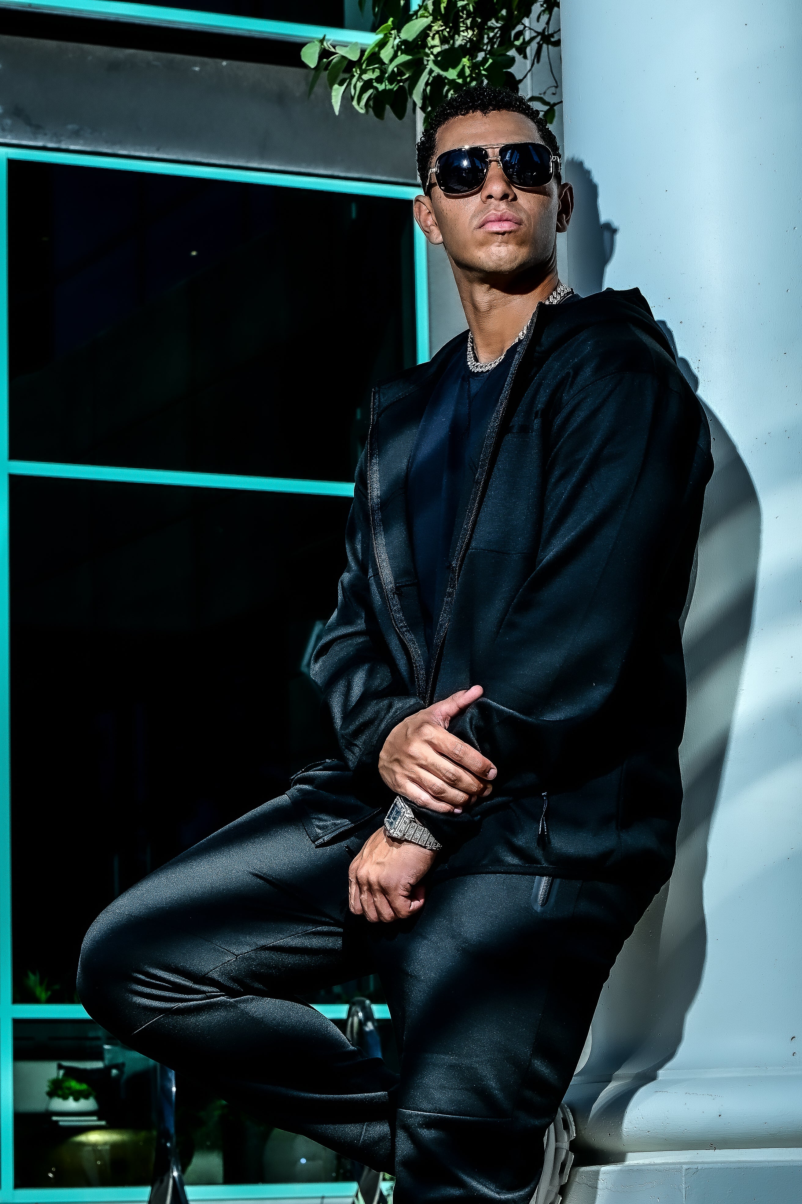 Men’s black Midnight Motion sweatsuit, zip-up hoodie and slim fit joggers, lifestyle detail view