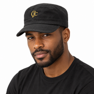 Male model wearing the black CJC military cadet cap with gold embroidered monogram.