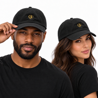 Man adjusting the brim of a black CJC cap beside a woman wearing the matching black cap with gold embroidery.