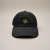 Front view of the CianniJ's CJC Black Twill Hat featuring an embroidered CJC monogram, structured crown, and adjustable buckle closure.
