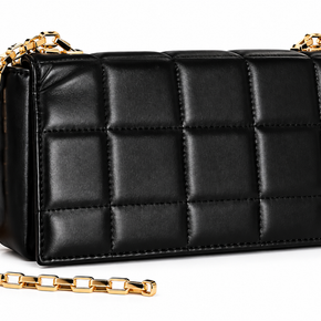 Black rectangular handbag with padded square quilting and a gold-tone chain strap on a white background.